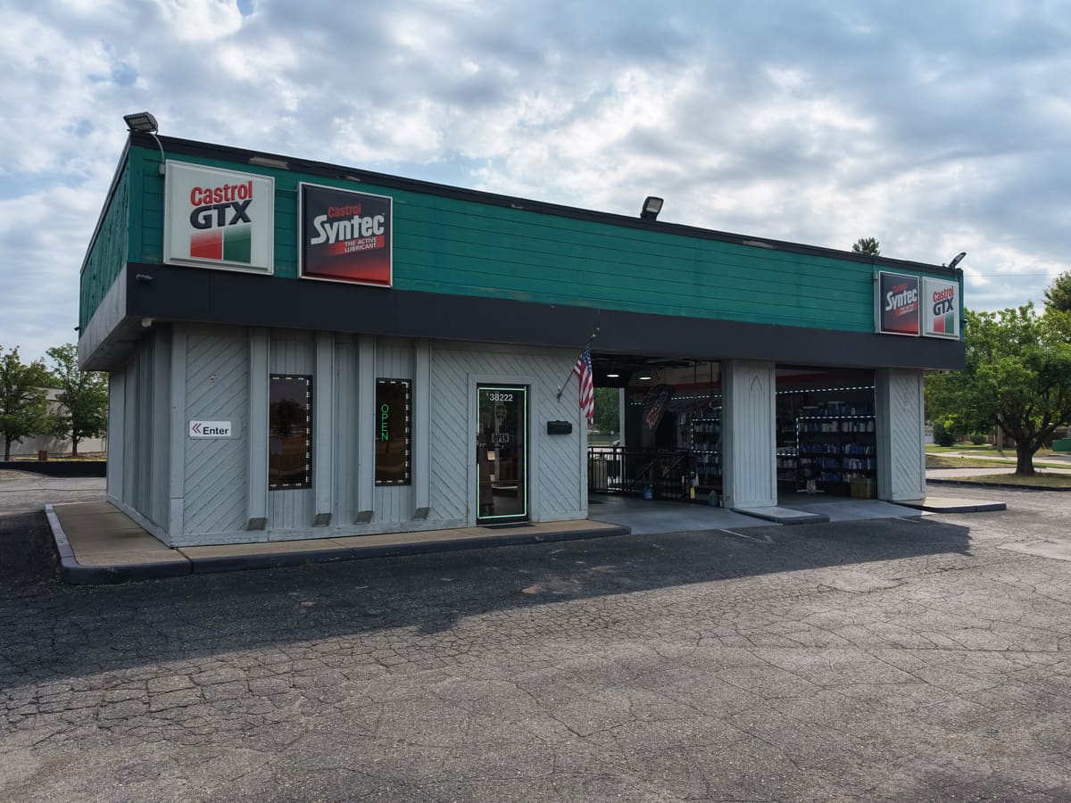 The Sterling Quick Lube building on Van Dyke Ave in Sterling Heights, Michigan, with Castrol GTX signage and the service bay doors open